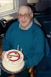 Claude with a cake Cynthia made him to celebrate quitting smoking